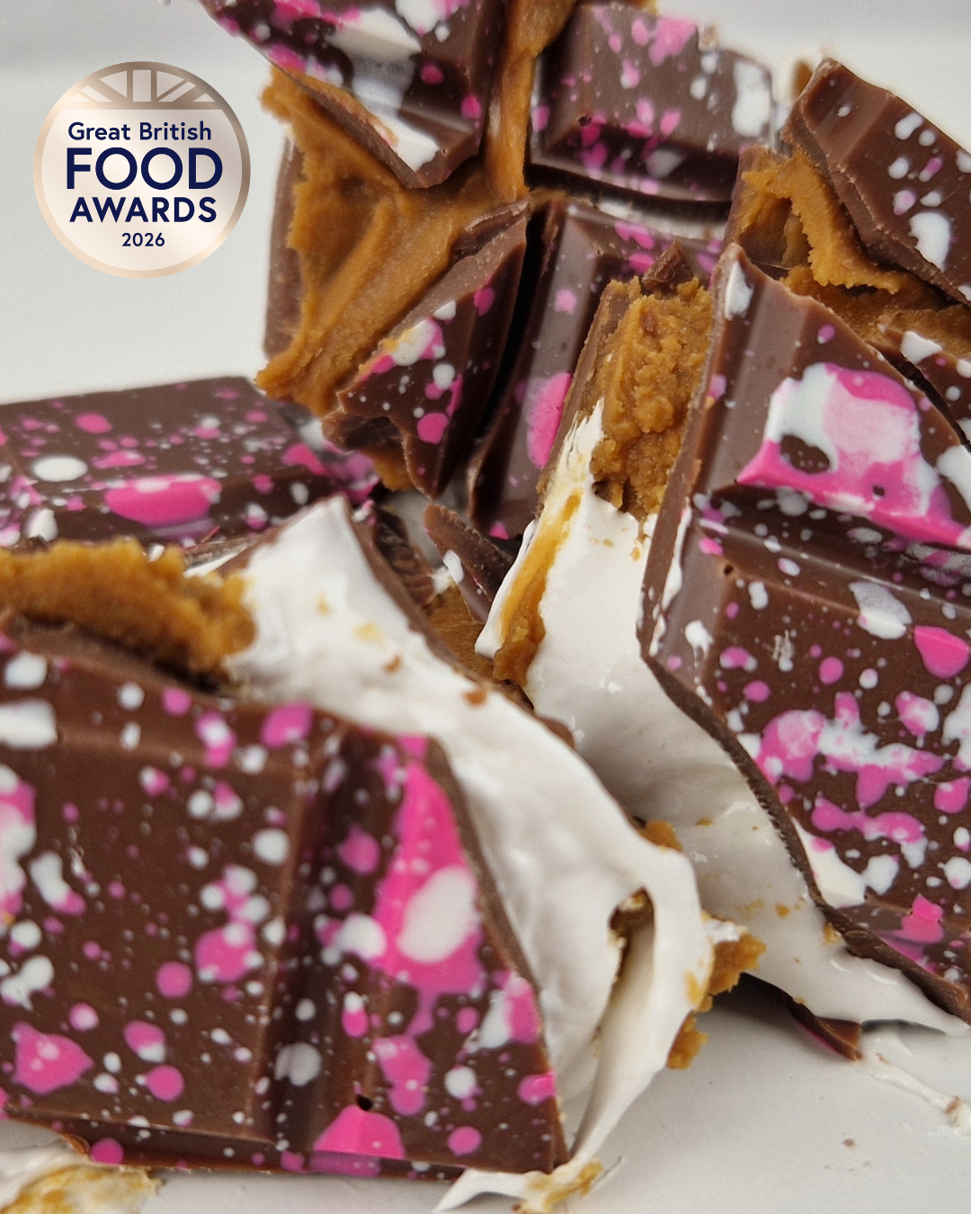 Broken S’mores stuffed chocolate bar with marshmallow fluff, Biscoff filling and Great British Food Awards 2026 Bronze badge