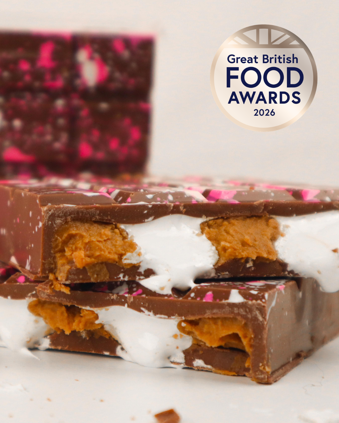 S’mores stuffed chocolate bars showing marshmallow fluff and Biscoff filling with Great British Food Awards 2026 Bronze badge